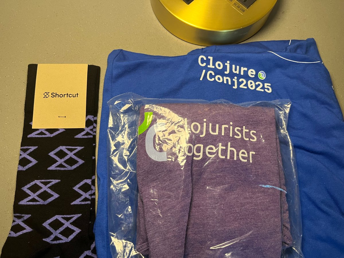 borkdude's tweet image. For someone who doesn&apos;t like shopping for new clothing that much, a developer conference like the #clojureconj where you get t-shirts and socks are so nice!