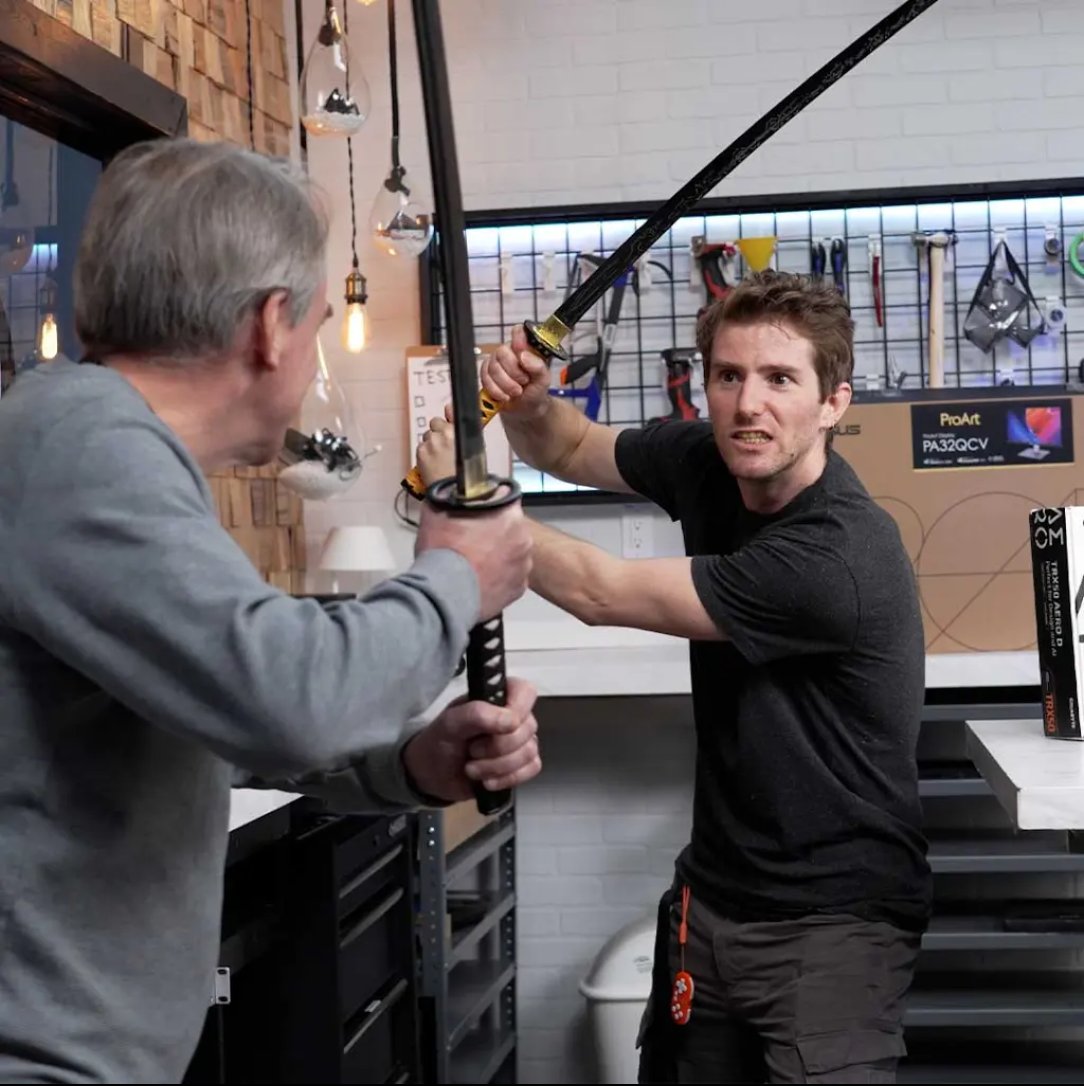 peach2k2's tweet image. prompt: Linus Tech Tips and Linus Torvalds fighting each other with katanas