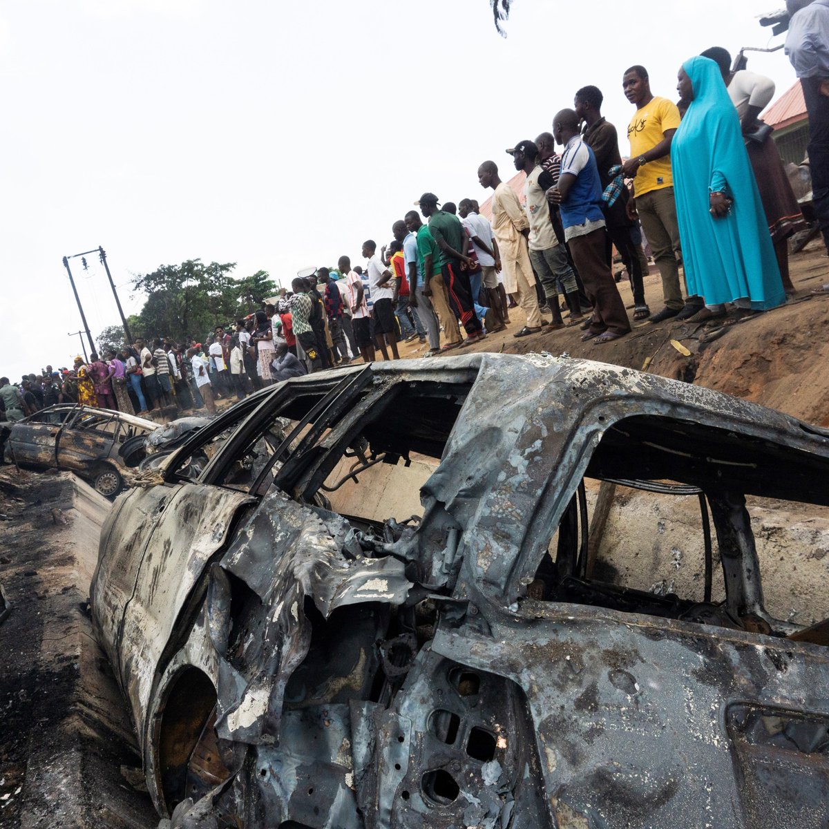 Omakadiri's tweet image. Milling is a unique pastime of the third worlder, an activity of partaking in no activity at all, aimlessly spectating at every chance. That is why shop owners and passers-by pause every activity just to indulge in this prolonged ritual. Not busy enough.
