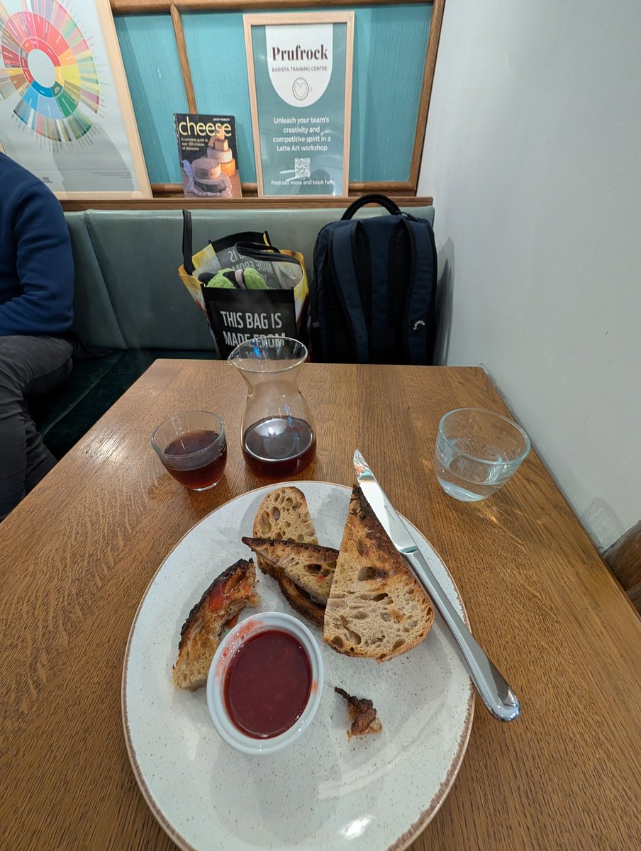 Quick coffee and toast this morning at <a href="/PrufrockCoffee/">Prufrock Coffee</a> in London. Absolutely delicious and bonus doggo in the background