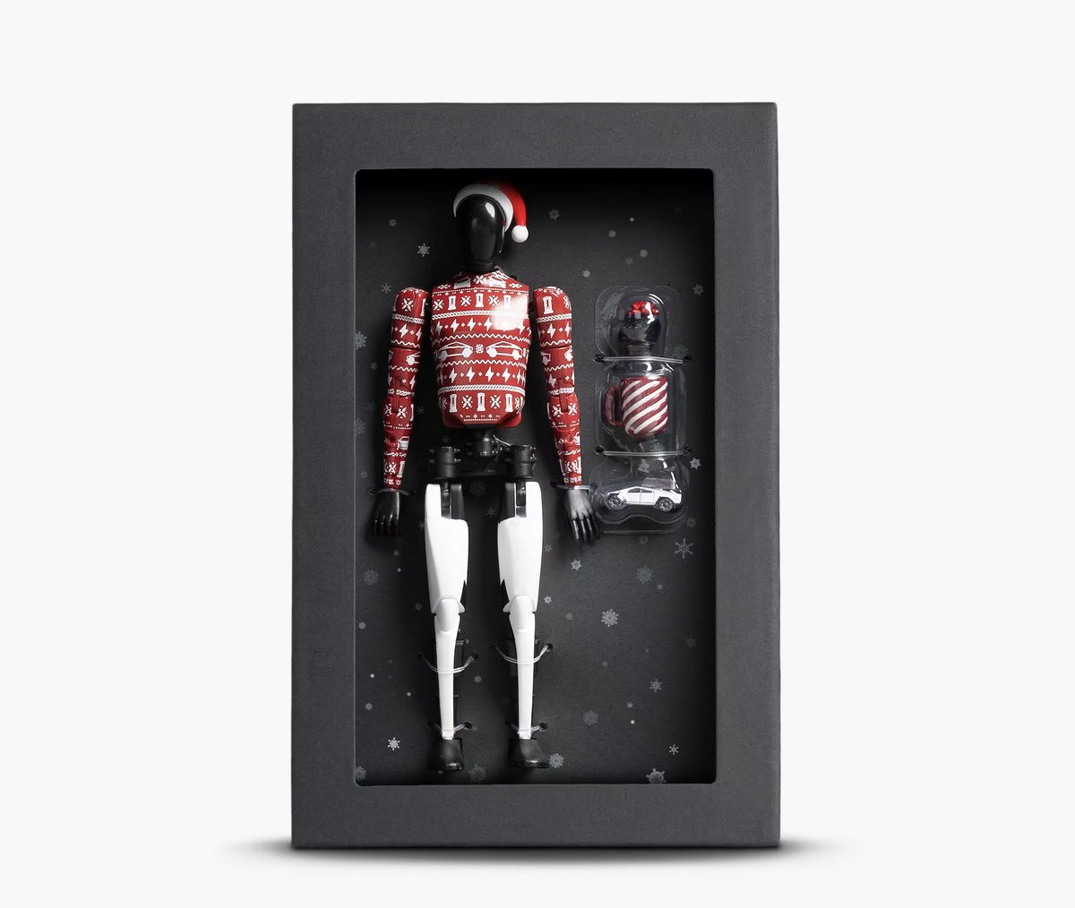 Tesla has released a Holiday Edition Tesla Bot action figure in