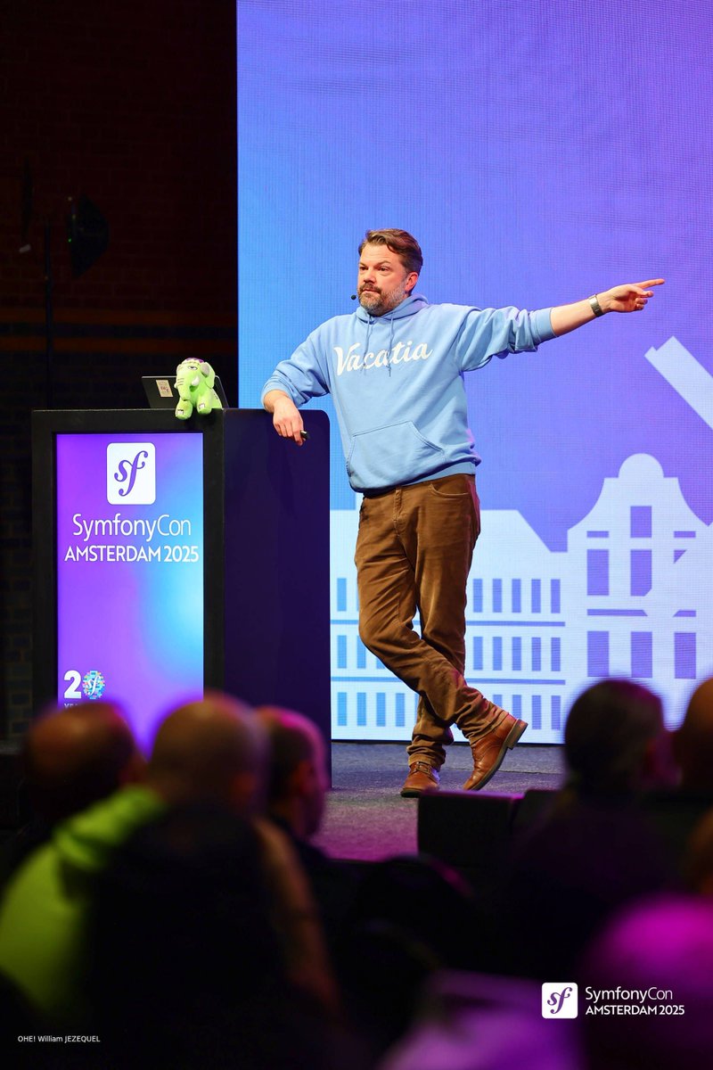 symfonycon's tweet image. 🚀Just on the mic:  Kris Wallsmith (@kriswallsmith) with “Unleash the Power of Symfony Messenger”

At #SymfonyCon Amsterdam 2025, Kris showed us advanced Messenger techniques — multiple buses and chaining messages to level up your Symfony apps! 💌⚡💜

#Symfony #PHP