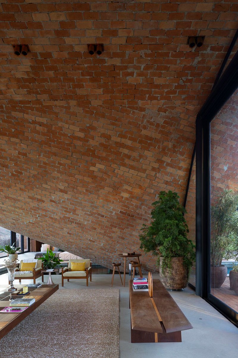 Archello's tweet image. Mareines Arquitetura crafts a Passive House that rises from the landscape, shaped by reforested terrain, curved exposed-brick roofing, and passive cooling strategies.
archello.com/project/passiv… 

#MaterialEcology #PassiveDesign #ContemporaryArchitecture
