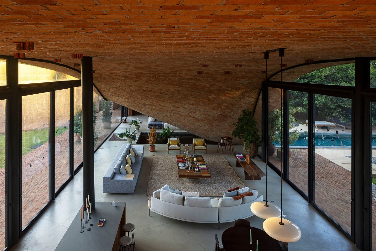 Archello's tweet image. Mareines Arquitetura crafts a Passive House that rises from the landscape, shaped by reforested terrain, curved exposed-brick roofing, and passive cooling strategies.
archello.com/project/passiv… 

#MaterialEcology #PassiveDesign #ContemporaryArchitecture