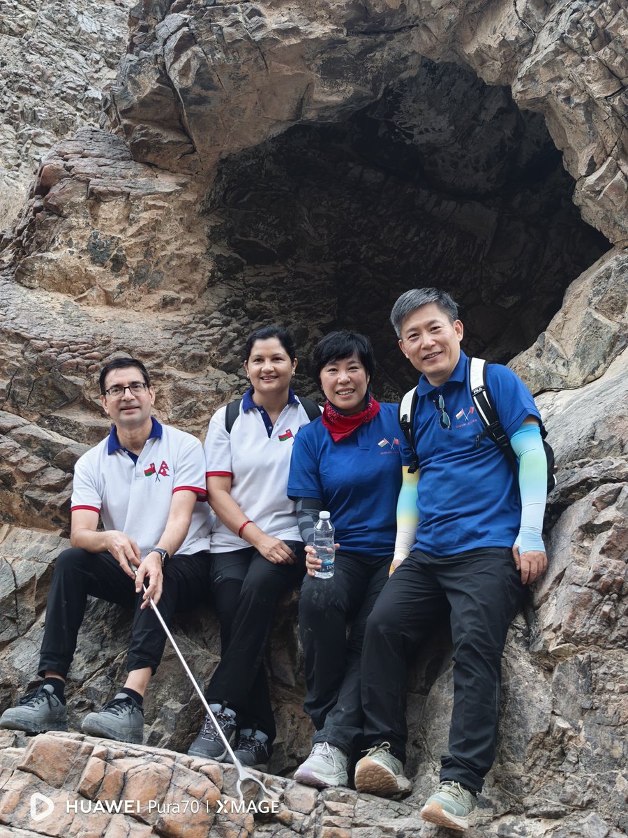 ChinaEmbOman's tweet photo. Today, we joined the Embassy of Nepal and friends in a joyful celebration of Oman's Glorious National Day! In a joyful, family-like atmosphere, Ambassador Lyu Jian and Mme. Tina joined Ambassador Dornath Aryal and Mme. Swodesh, alongside colleagues and friends, for a meaningful hike along the C38 trail. We combined the appreciation of stunning coastal views with a collective effort to clean the path, contributing to environmental protection.

The activity left everyone feeling refreshed and happy. As evening fell, the view of the castle—adorned with special National Day lights against the sea—was truly memorable. A special thanks to our professional guides, Abudullah and Fathiya, for their outstanding support!

Happy Glorious National Day! Longlive friendship! @NepalinOman