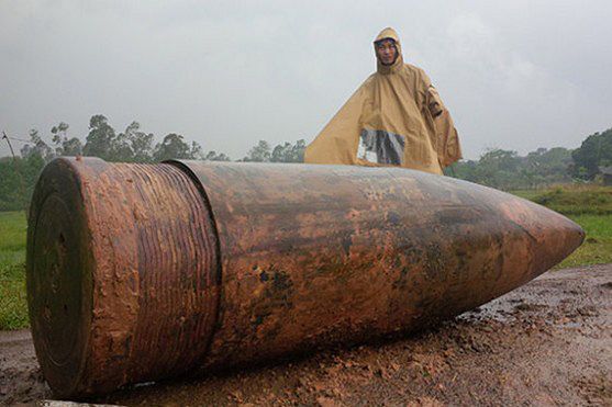 American forces dropped an insane amount of ordnance on Vietnam. Pictured here is the largest example ever discovered: a 1900 pound naval gun shell fired from offshore on Quang Tri province.
Even with a very small percentage of these explosives failing to detonate on impact, with