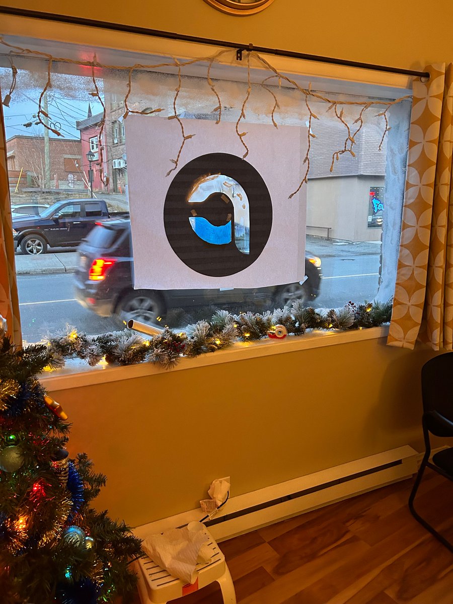 PurvisCulbert's tweet image. We had a fun time decorating our offices today for the holidays! We even worked a temporary window logo into our design. Chester approves! #teamwork 
# holidaydecor #lawoffice