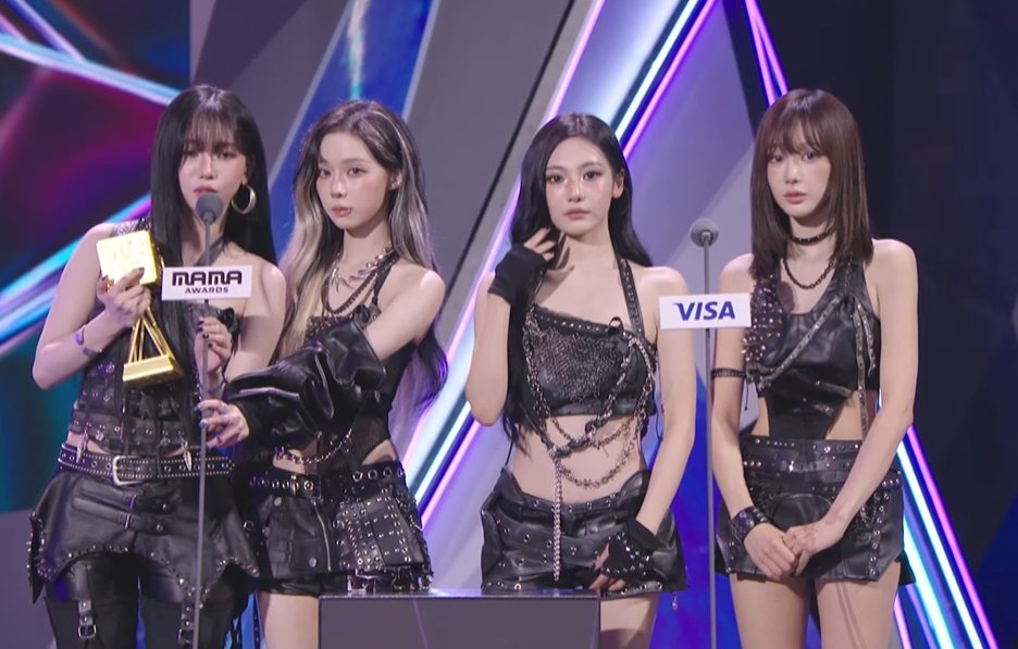 aespa accepts the Best Female Group award at the 2025 MAMA Awards.