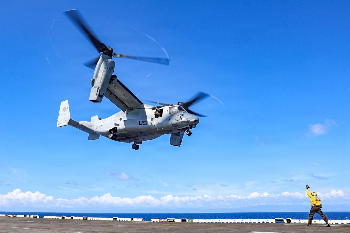 Southcom's tweet image. A @USNavy Sailor, assigned to the Iwo Jima Amphibious Ready Group, signals for an MV-22B Osprey tiltrotor aircraft to take off from the flight deck of Wasp-class amphibious assault ship USS Iwo Jima (LHD 7) while underway in the Caribbean Sea. U.S. military forces are deployed to…