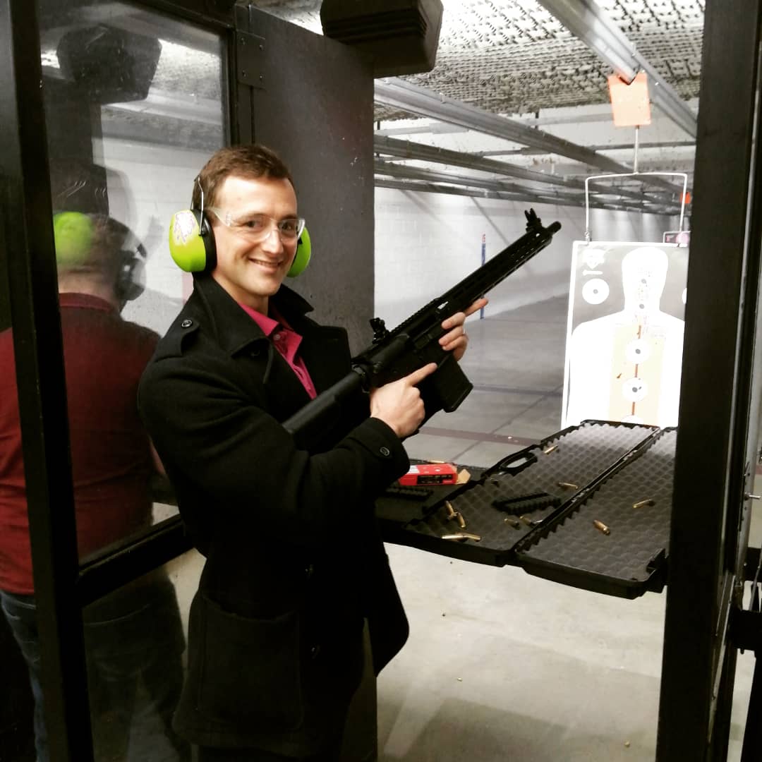 Let's test this out: Here I am posing in the US with a frigging AR10. I'm a British citizen and fly back to the UK regularly.

Have at it, lads.