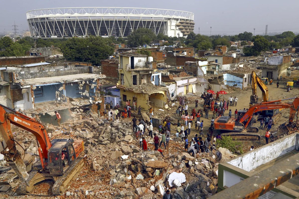 timesofindia's tweet image. #InPics | The Ahmedabad Municipal Corporation (AMC) carried out a demolition drive near Narendra Modi Stadium on Saturday to remove illegal encroachments in the area. 

#Ahmedabad #AMC #DemolitionDrive