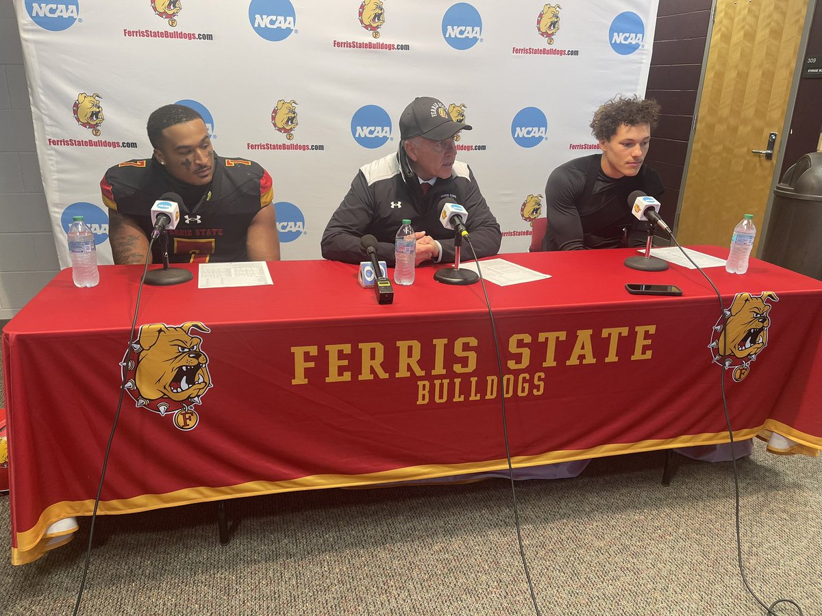 FerrisFootball's tweet photo. In the post-game press conference, head coach Tony Annese has linebacker Isaiah Byars (left) and quarterback Chase Carter (right) answering questions with him. The Bulldogs beat Ashland 56-24 in the second round of the playoffs. https://t.co/ocrdMpAioi