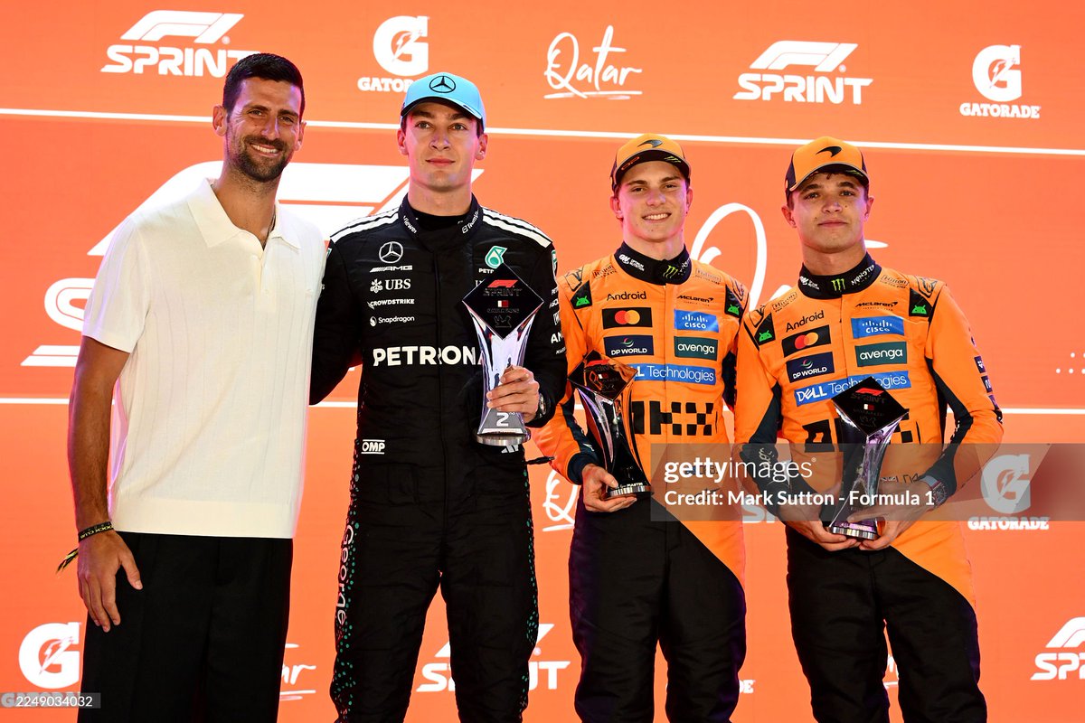 NovakFanClub's tweet photo. Novak Djokovic presents Third placed Lando Norris  and McLaren with his trophy 🏁 🏎 

 @f1  

#Qatar 

 (Photo by Steven Tee/LAT Images) https://t.co/mGN2Rwo6eQ