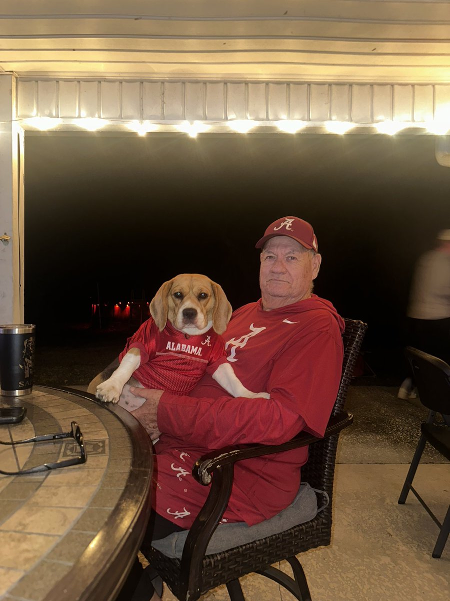Miss Baylee sitting with Old Salty, her best friend! 

Roll Tide!