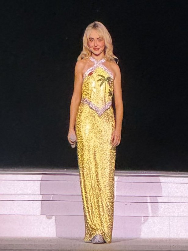 Sabrina Carpenter is wearing a new yellow outfit with palm trees at night two of #LAShortnSweet! Sabrina Carpenter is wearing a new yellow outfit with palm trees at night two of #LAShortnSweet!
