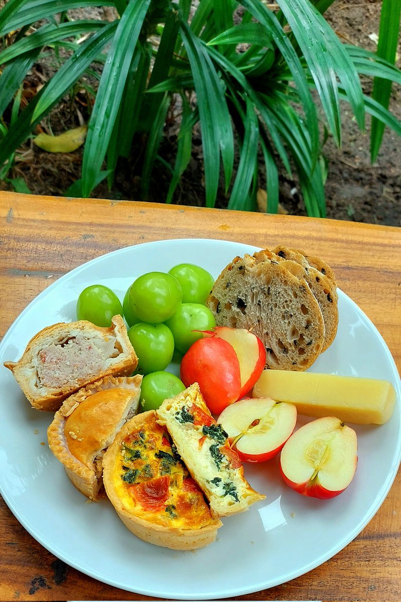 Wife did a bit of shopping at the supermarket and bought me a few of the things I like for lunch. 
Delicious pork pie, a few different quiches, fresh sourdough olive bread, the apples and grapes from our local market. 
Really enjoyed this 😋