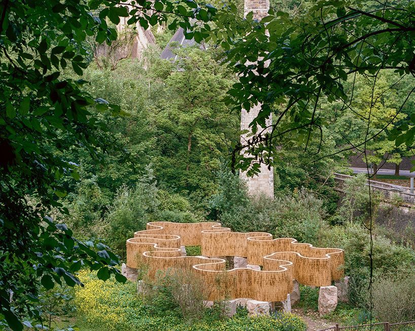 designboom's tweet image. atelier faber stacks reeds over luxembourg sandstone to revive soil porosity on old well site designboom.com/architecture/a…