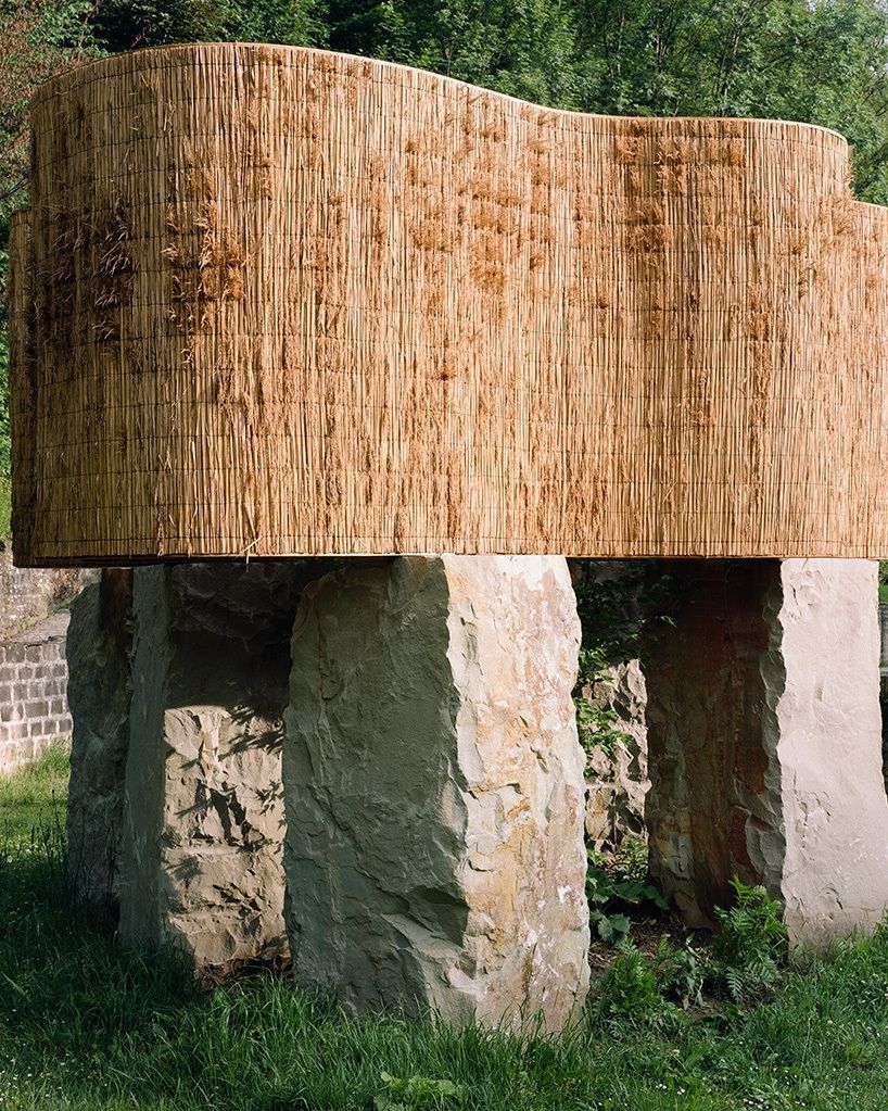 designboom's tweet image. atelier faber stacks reeds over luxembourg sandstone to revive soil porosity on old well site designboom.com/architecture/a…