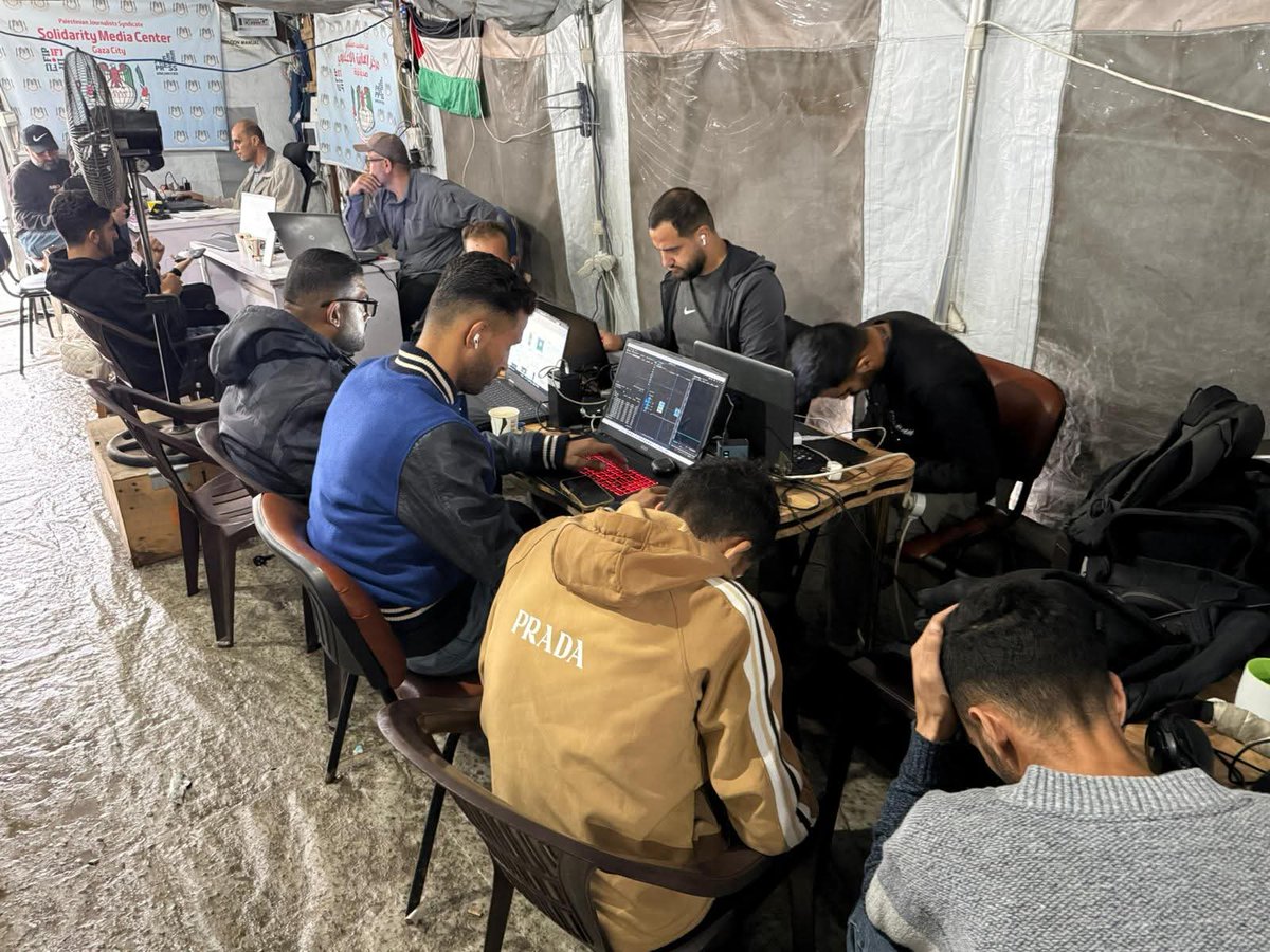 PalPress24's tweet image. Amid the rainy weather in the Gaza Strip, journalists continue their work from inside the Media Solidarity Center in Gaza City, which is affiliated with the Palestinian Journalists’ Syndicate.