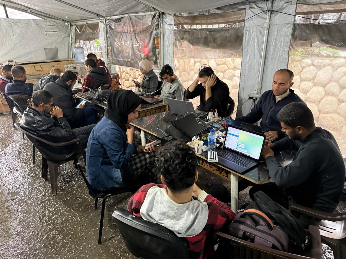 PalPress24's tweet image. Amid the rainy weather in the Gaza Strip, journalists continue their work from inside the Media Solidarity Center in Gaza City, which is affiliated with the Palestinian Journalists’ Syndicate.