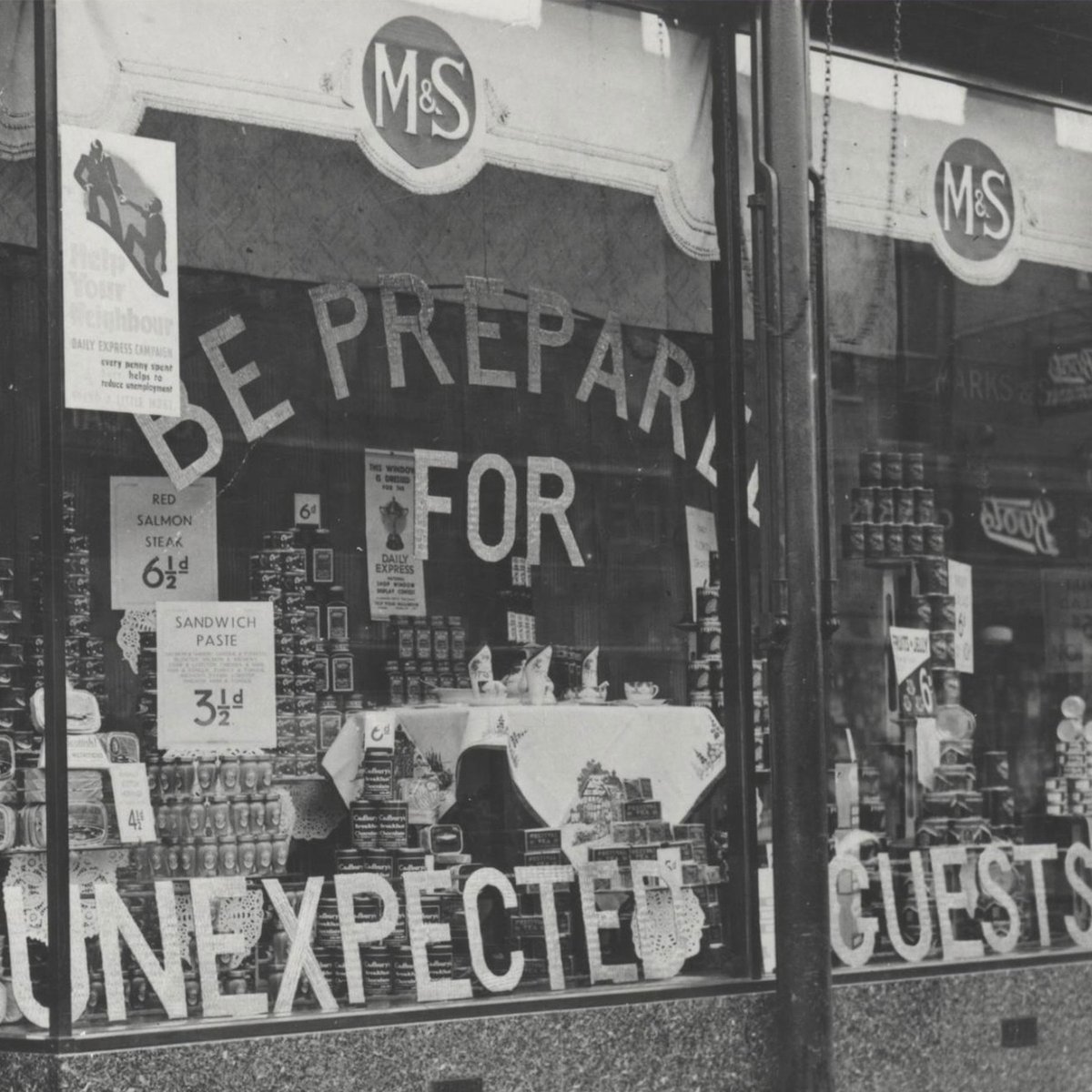 This week's #archivefavourite carries an important message - Be Prepared for Unexpected Guests! 

This brilliant window display from 1939 showcased the store cupboard essentials necessary for last-minute hosting.