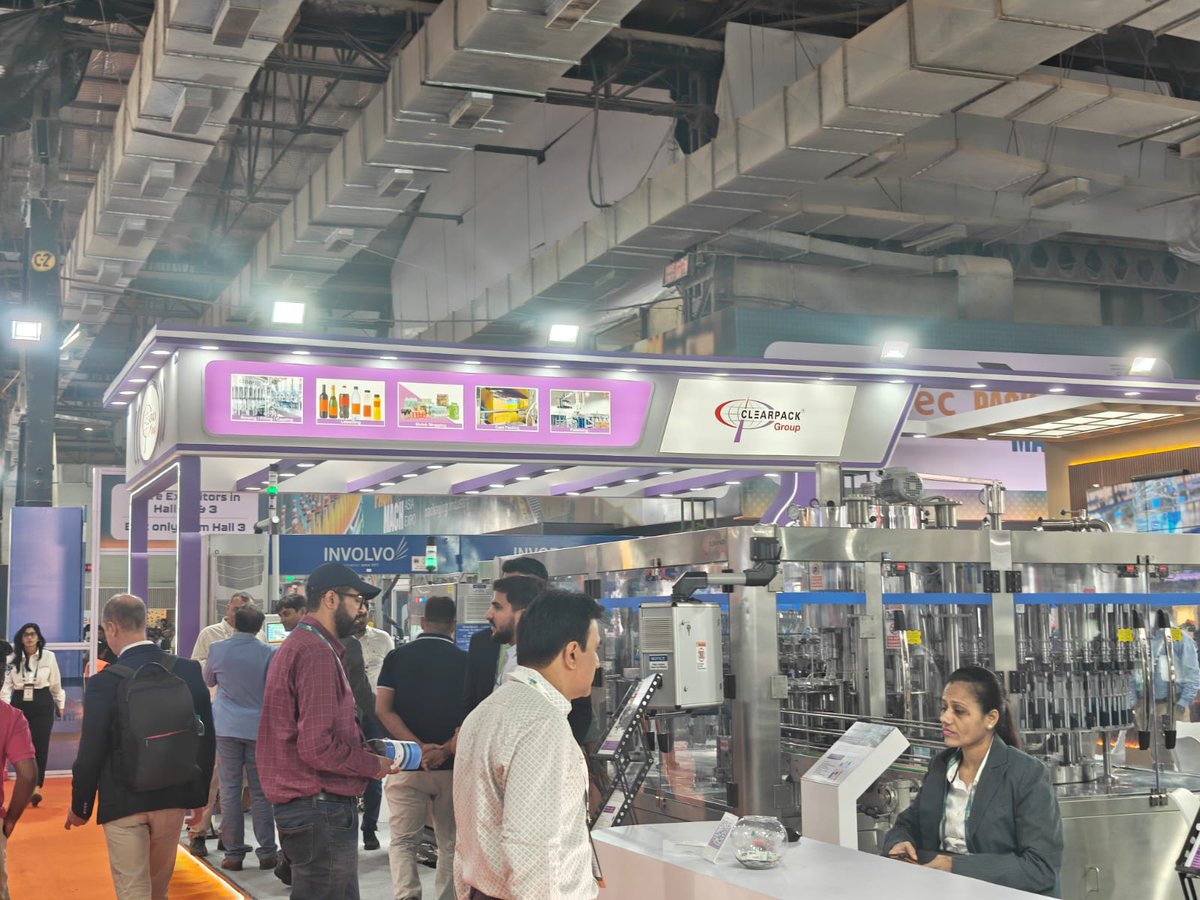 WhatPackaging's tweet image. Clearpack Group demoed its printed shrink-pack systems at #PackMachAsia Expo 2025 and @DrinkTechnology India, highlighting the shift from transparent film to registration-based printed wraps. The team also announced plans to launch its own blow-moulding machine next year.
