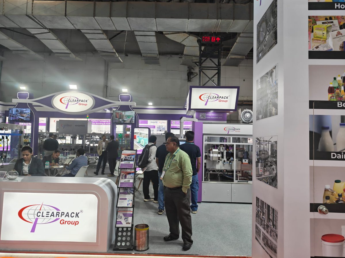 WhatPackaging's tweet image. Clearpack Group demoed its printed shrink-pack systems at #PackMachAsia Expo 2025 and @DrinkTechnology India, highlighting the shift from transparent film to registration-based printed wraps. The team also announced plans to launch its own blow-moulding machine next year.