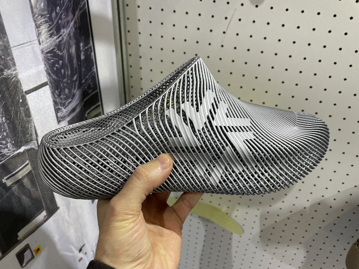MaxFunkner's tweet image. Took my Flux 3D printed shoes by @pollyfab3d, 12.1 Booth F68, to Formnext for a proper stress test. Surprisingly comfy, especially with the official @Formnext socks! :) #formnext #formnext2025 #3Dprintedshoes