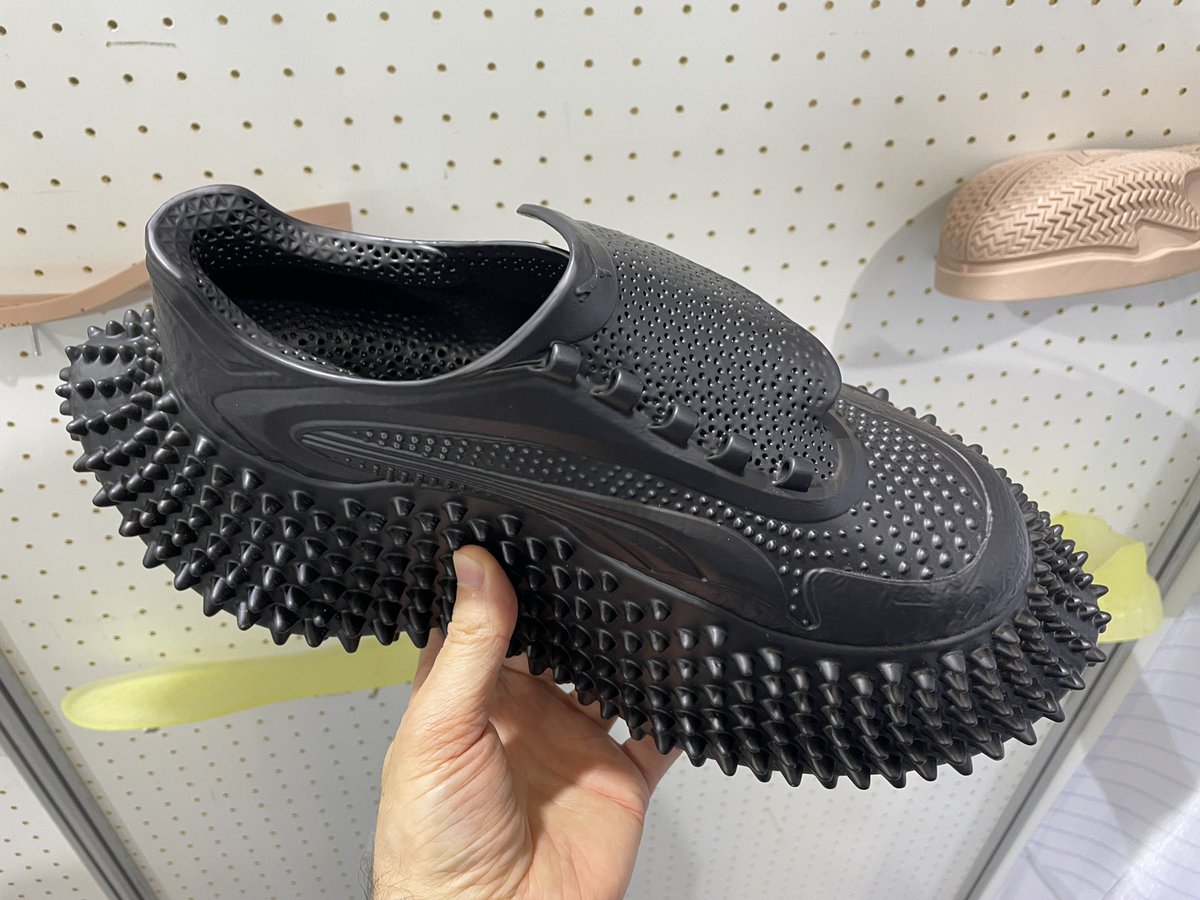 MaxFunkner's tweet image. Took my Flux 3D printed shoes by @pollyfab3d, 12.1 Booth F68, to Formnext for a proper stress test. Surprisingly comfy, especially with the official @Formnext socks! :) #formnext #formnext2025 #3Dprintedshoes