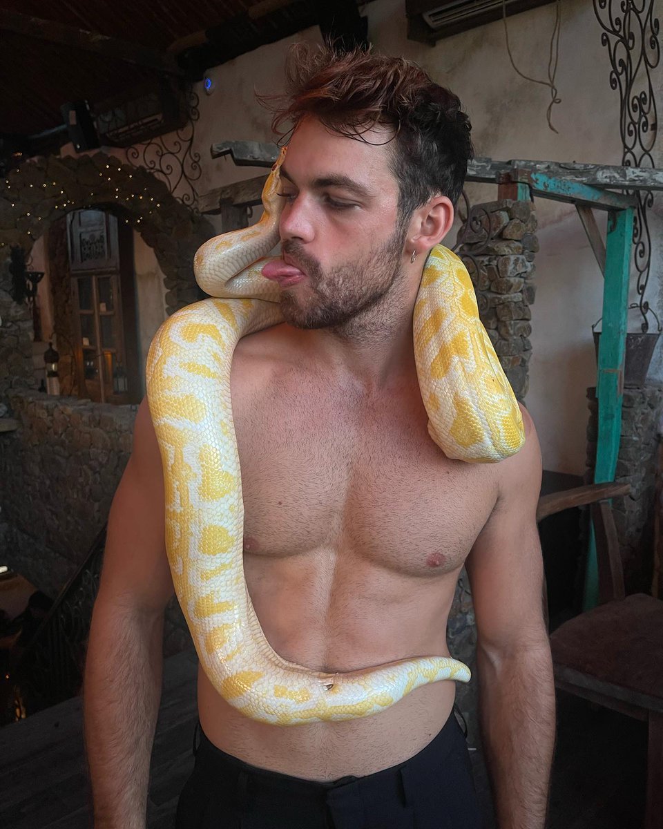 Andreas Jon Beel befriends with a yellow python... 😛 🔥 🐍