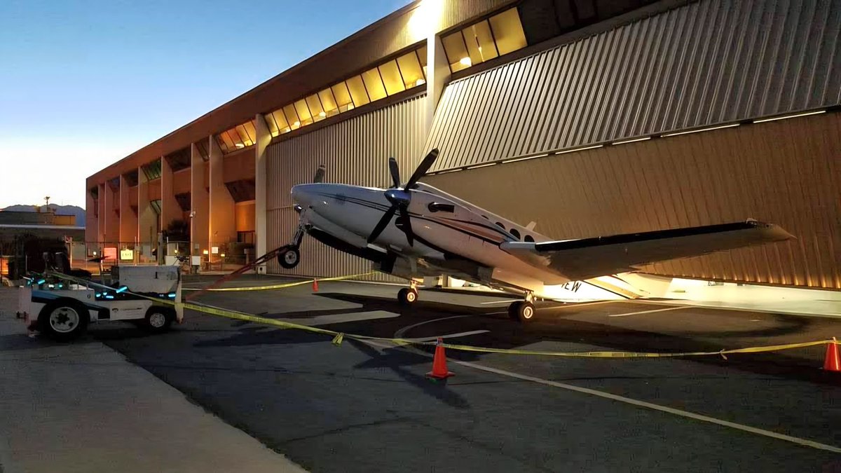 ClintFiore's tweet image. In case you&apos;re wondering what it looks like when the steel cables on your hangar&apos;s bi-fold doors snap while you&apos;re moving your brand new King Air out of it.