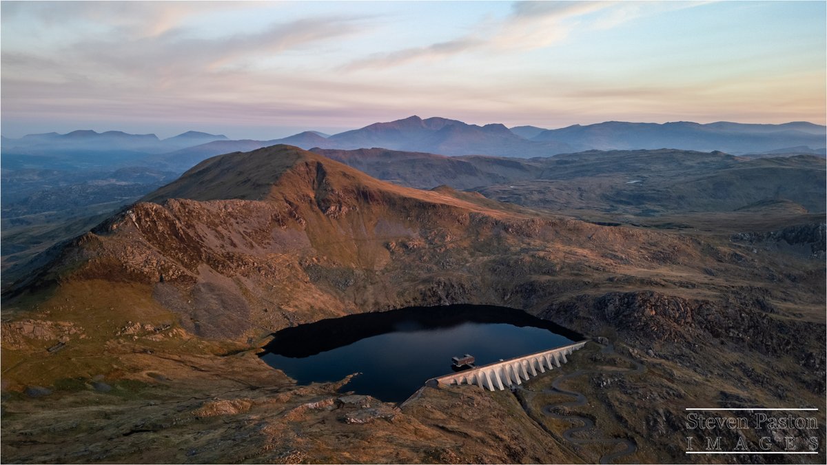 StevenPaston's tweet image. What a view of the surrounding mountains from the top of Stwlan Dam in Snowdonia on a road trip I took back in April @DJIGlobal @StormHour #Mini3Pro