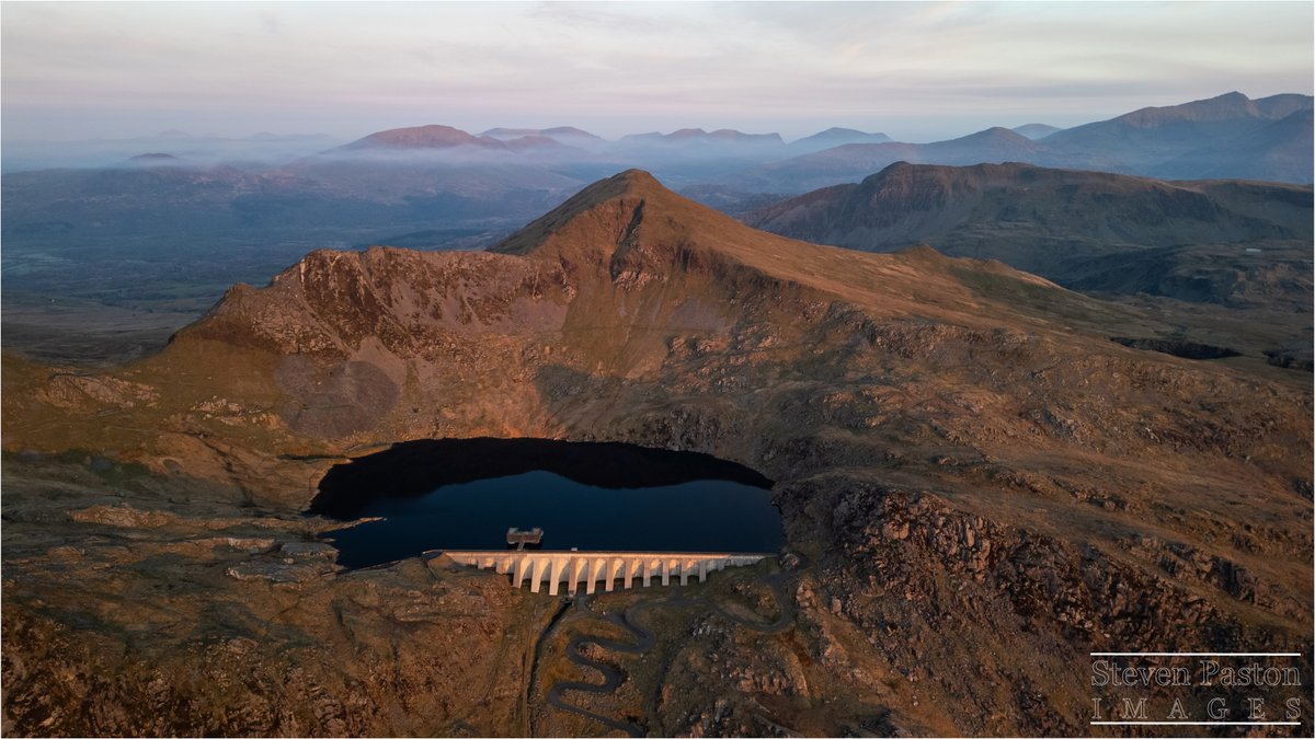 StevenPaston's tweet image. What a view of the surrounding mountains from the top of Stwlan Dam in Snowdonia on a road trip I took back in April @DJIGlobal @StormHour #Mini3Pro