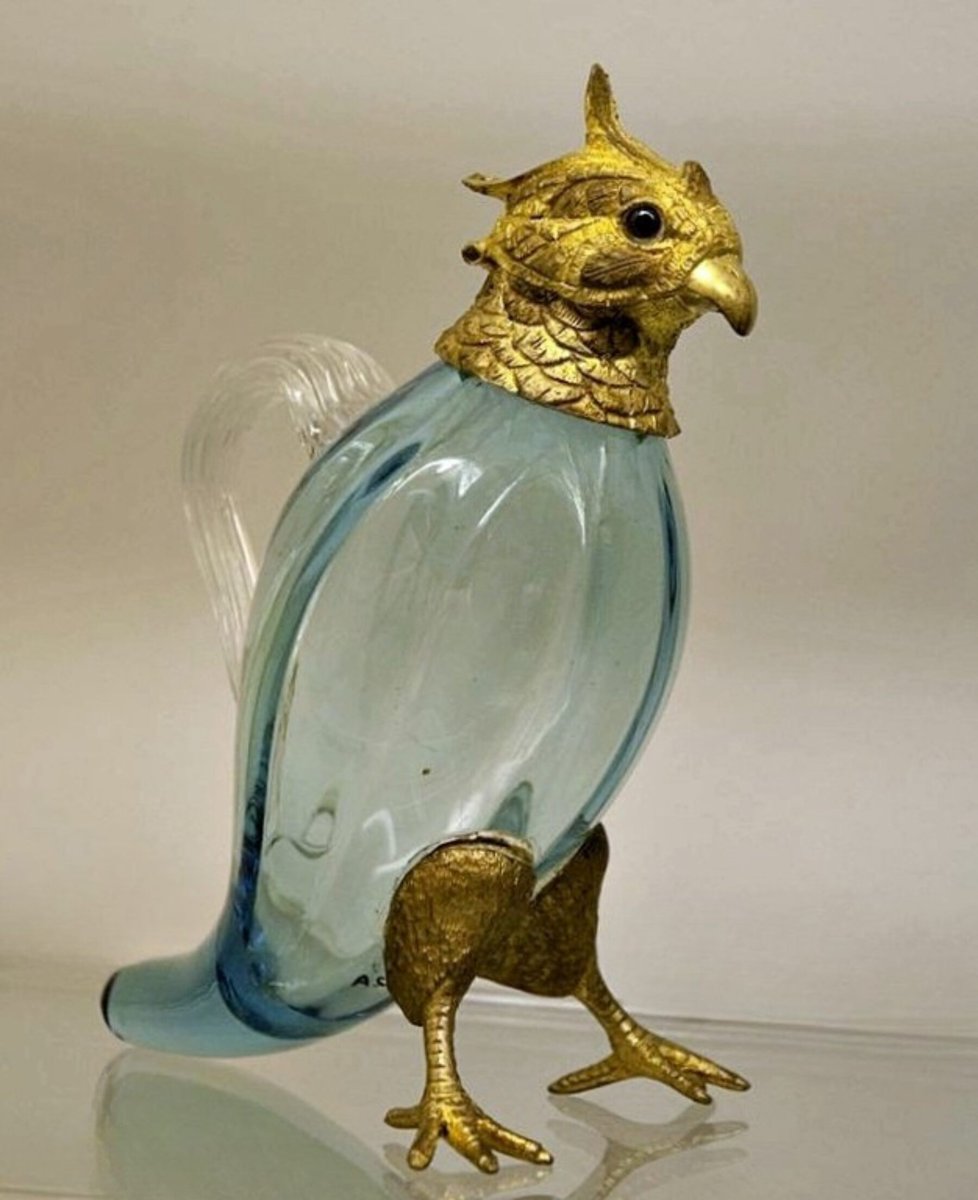 archaeologyart's tweet image. Bird-shaped perfume bottle with stopper. Probably England. Date: c. AD 1880–1890. Medium: pale blue blown glass with gilded metal mounts. Collection: Royal Ontario Museum, Toronto.