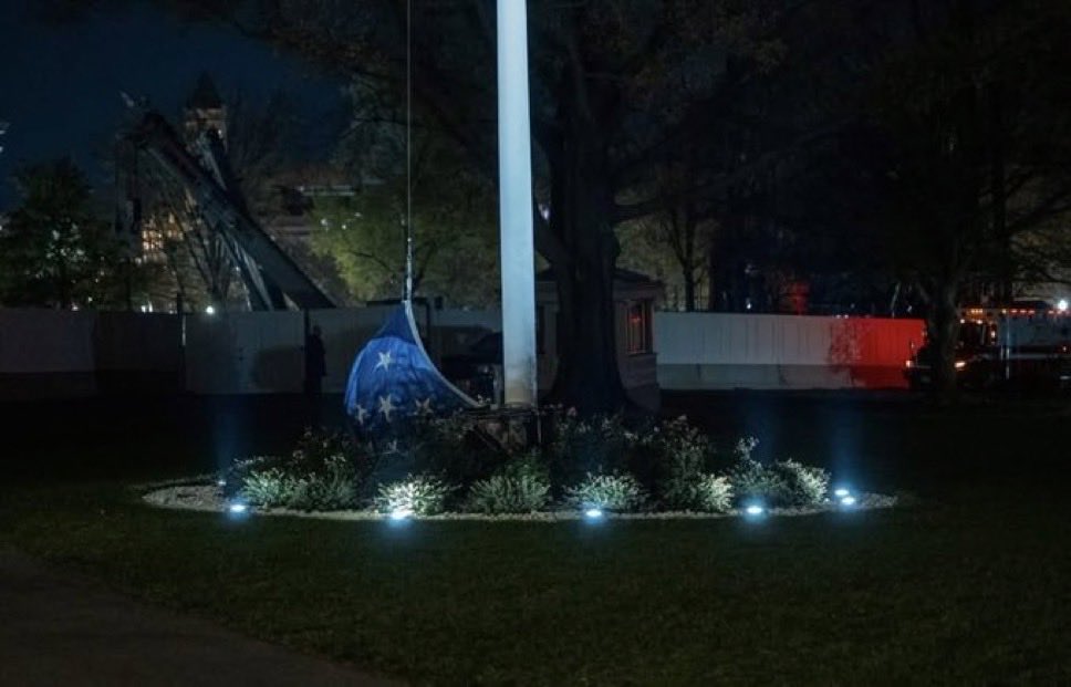 Gechi's tweet image. Our flag on the ground with the destroyed East Wing behind it… truly symbolizes what has happened to this country.