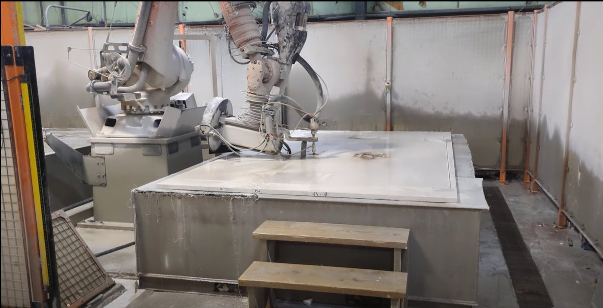 Another day, another factory tour! This robot cuts stone countertops.