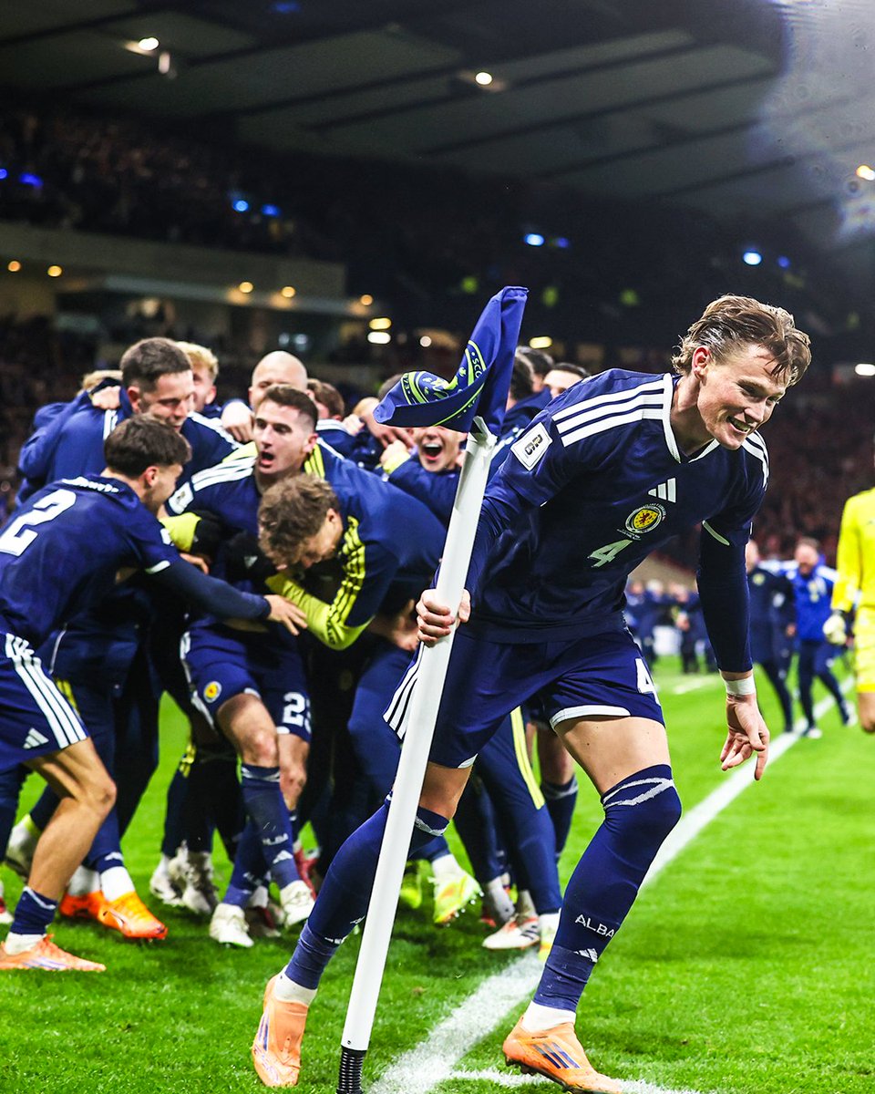 brfootball's tweet photo. Scott McTominay ran off with the corner flag in Scotland's celebrations 🍾 https://t.co/LYtW2kHqtq