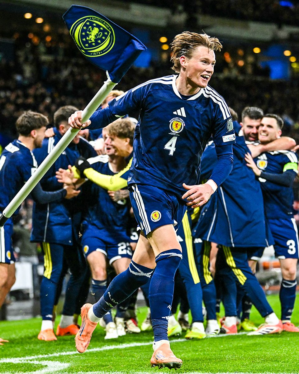 brfootball's tweet photo. Scott McTominay ran off with the corner flag in Scotland's celebrations 🍾 https://t.co/LYtW2kHqtq