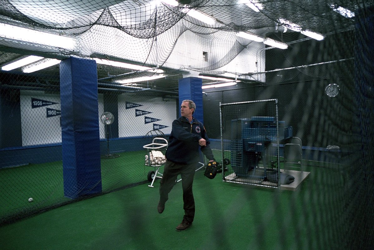 TheBushArchive's tweet image. George W. Bush preparing for his ceremonial first pitch at Yankee Stadium after 9/11