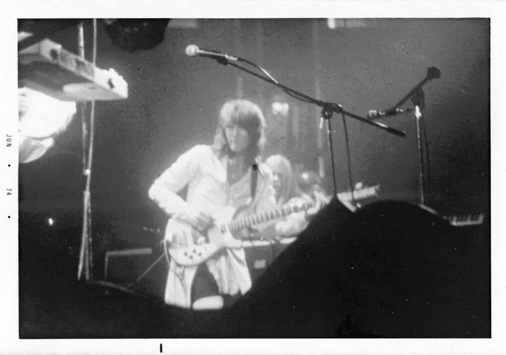 "JUN 74" date is obviously not accurate... YES would have been between the tail of their touring for "Tales From Topographic Oceans" and beginning of that for their "Relayer" album. 

Keyboards rig to right of Chris Squire manned by Rick Wakeman would have put this much earlier.