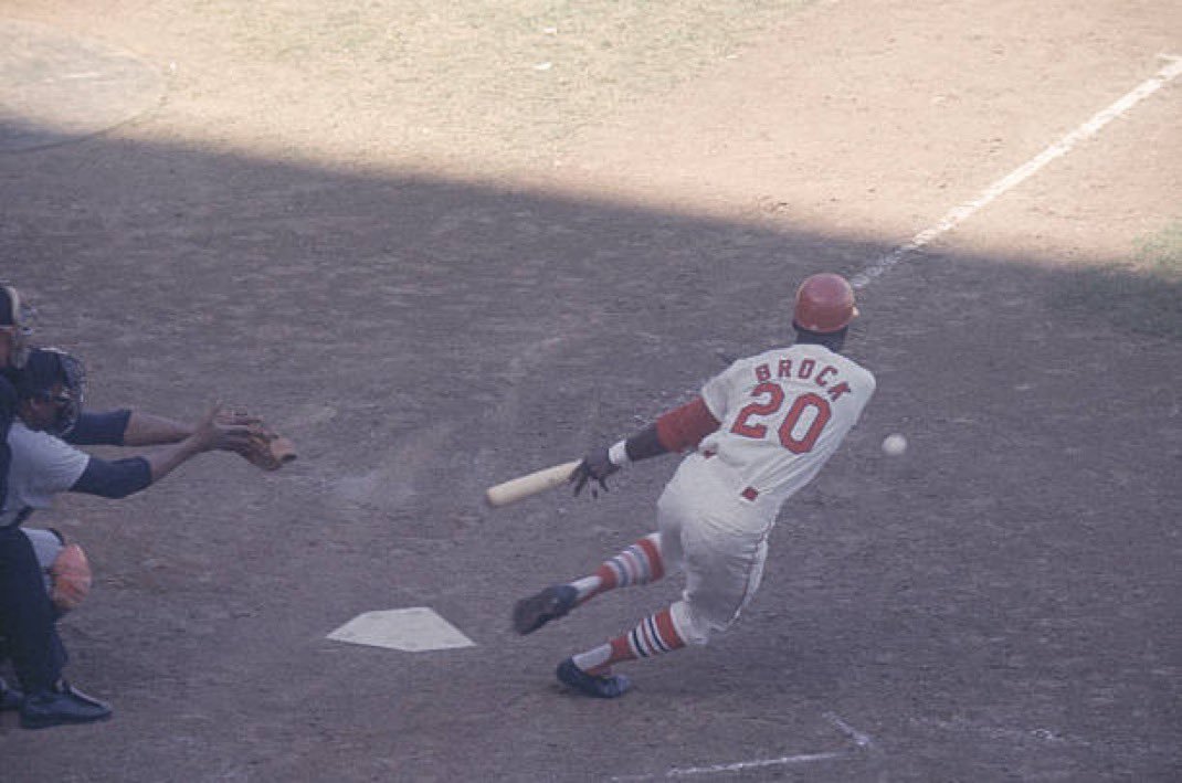 Lou Brock lays down a bunt. Lost art these days.