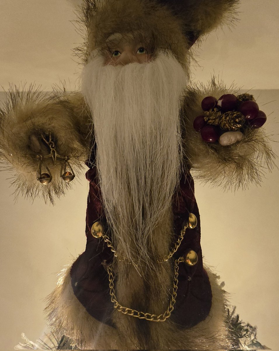 In 2018, I improved this Father Christmas tree topper by replacing his lantern with the scales of justice. 

Since then, every year the main tree has been adorned with Father Justice. 🎅⚖️

The tree is quite tall, so his noggin hits the ceiling. 😂 (He doesn't seem to mind!)