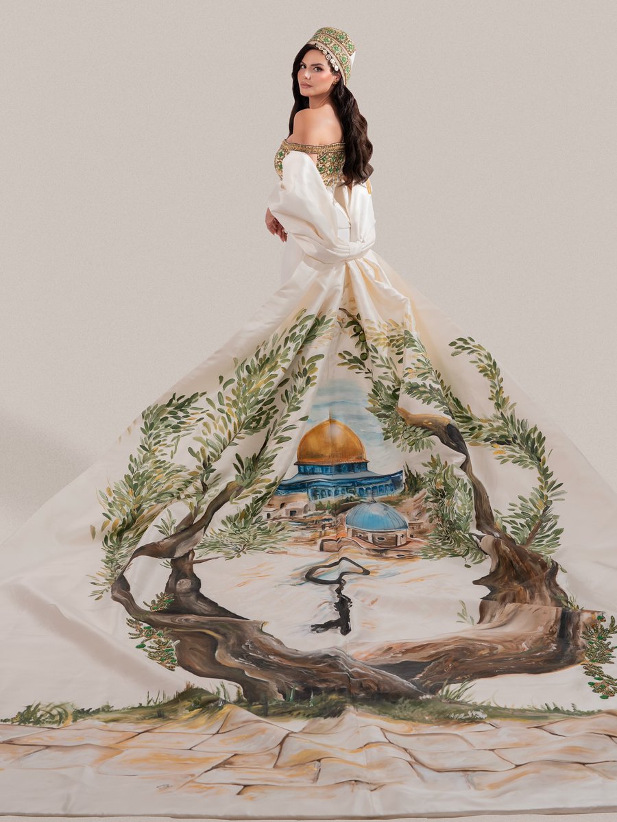 Miss Palestine isn’t just wearing a dress, she’s wearing our heritage: a mosque, a church, and olive trees woven into one unbreakable Palestinian story.
 And honestly… I loved it so much😍😍