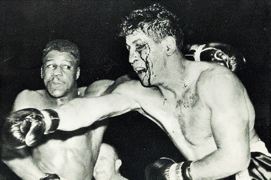 Ellsworth "Spider" Webb (left) and Joey Giardello battle on November 19, 1958, in an outstanding middleweight matchup at the Cow Palace in Daly City, California.

Webb stops Giardello, on cuts, in the 7th round.

The Oakland Tribune report on the fight read:

"Spider Webb