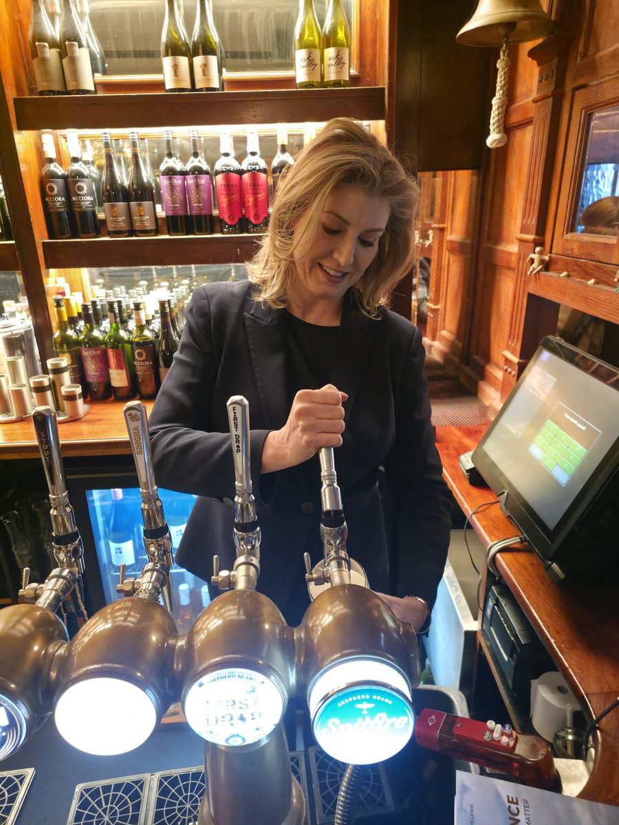 PennyMordaunt's tweet image. The Westminster Arms has a new barmaid. Well, I need the work folks. Keep an eye on the @Daily_Express to find out why I’ve been pulling pints with @rkhigham. Thank you to Jonathan Buckmaster for the pix.