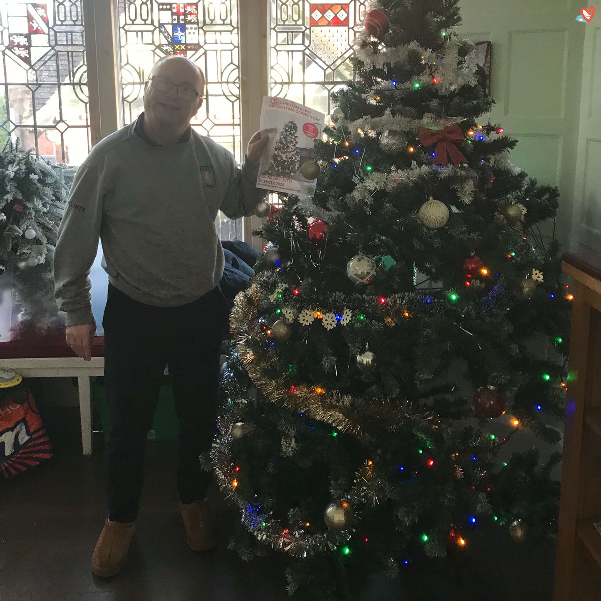 Is it too early for a Christmas picture? Er...tough. 
At least one of our houses has the tree up - which was handy because we launched our Trust-wide Christmas Tree decorating competition this week. Here's Steven with the poster and the tree in his home #Fun #Choice