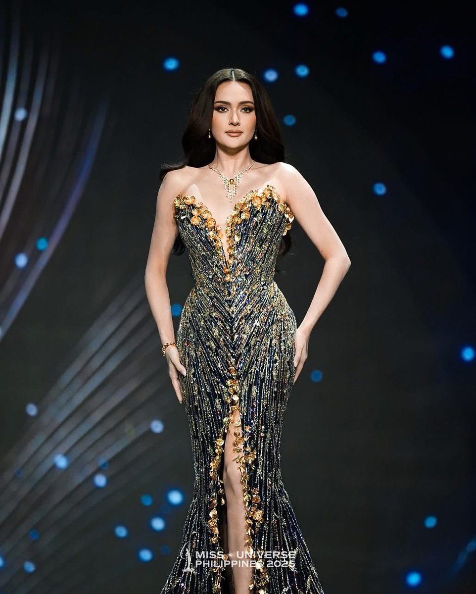THIS IS HER MOMENT  LOOK: Ahtisa Manalo delivers a stunning, crown-ready  performance in her Pinctada evening gown, designed by Mak Tumang in  Bangkok, Thailand. Manalo is vying to bring home the