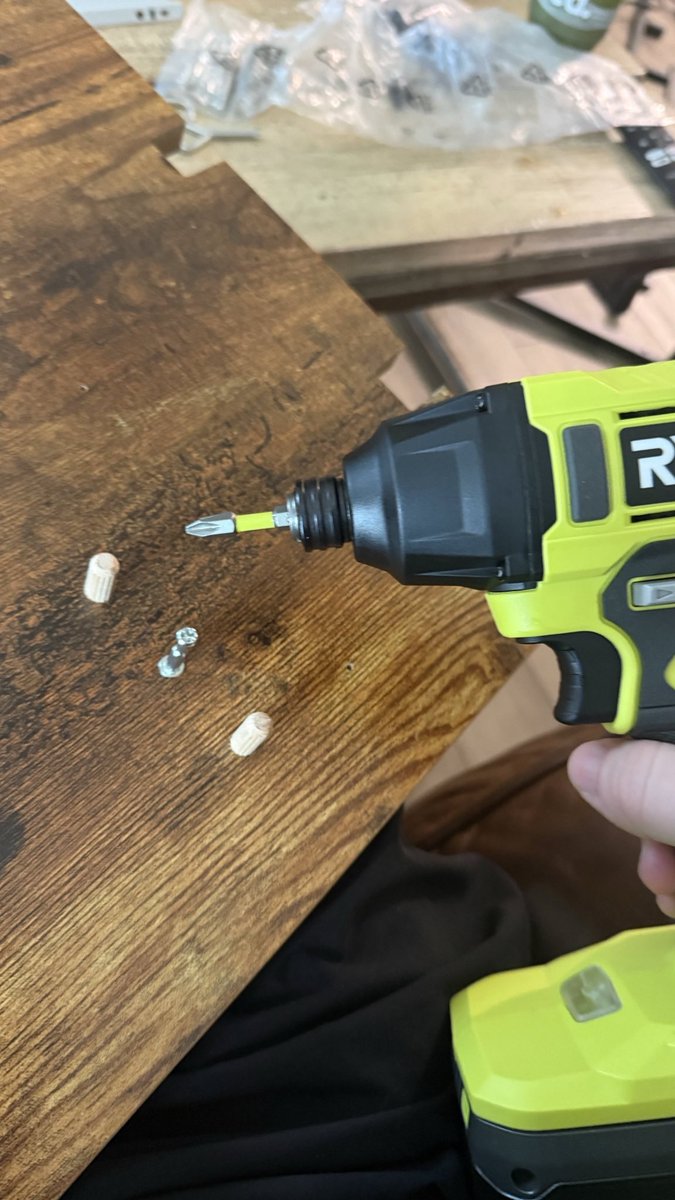 in the livinged room straight up “building it” .  and by it, let’s just say,,   my cabineats