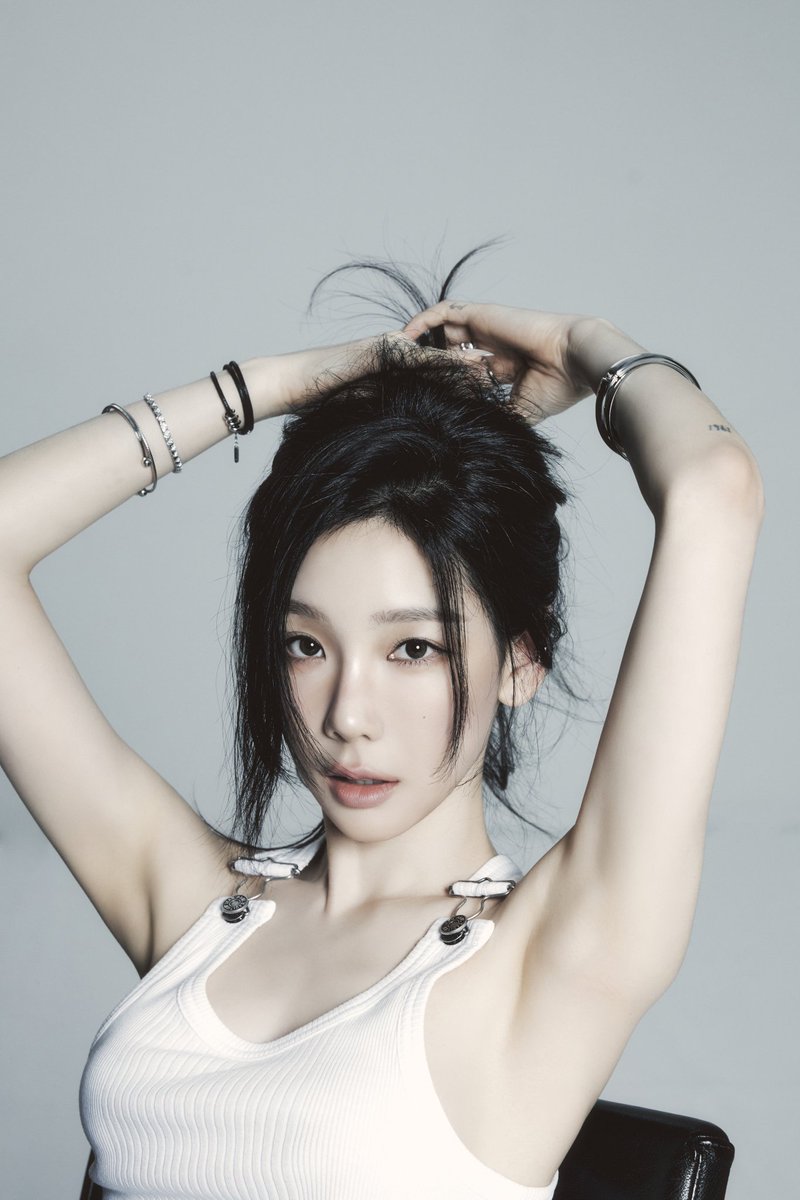 pinkpurple1518's tweet image. Taeyeon wear Jean Paul Gaultier Tank Top