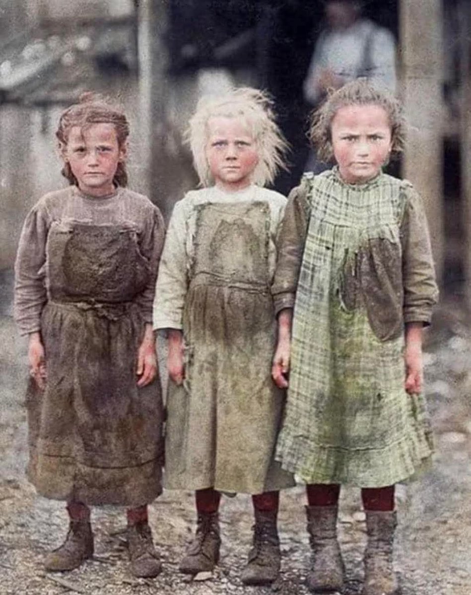 Oyster shuckers in South Carolina, 1912 — Josie (6), Bertha (6), and Sophie (10) starting work at 4 AM in the Maggioni Canning Co.”

This photograph, taken in 1912, by 
Lewis Hine; shows three young girls working in the Maggioni Canning Company along the South Carolina coast.